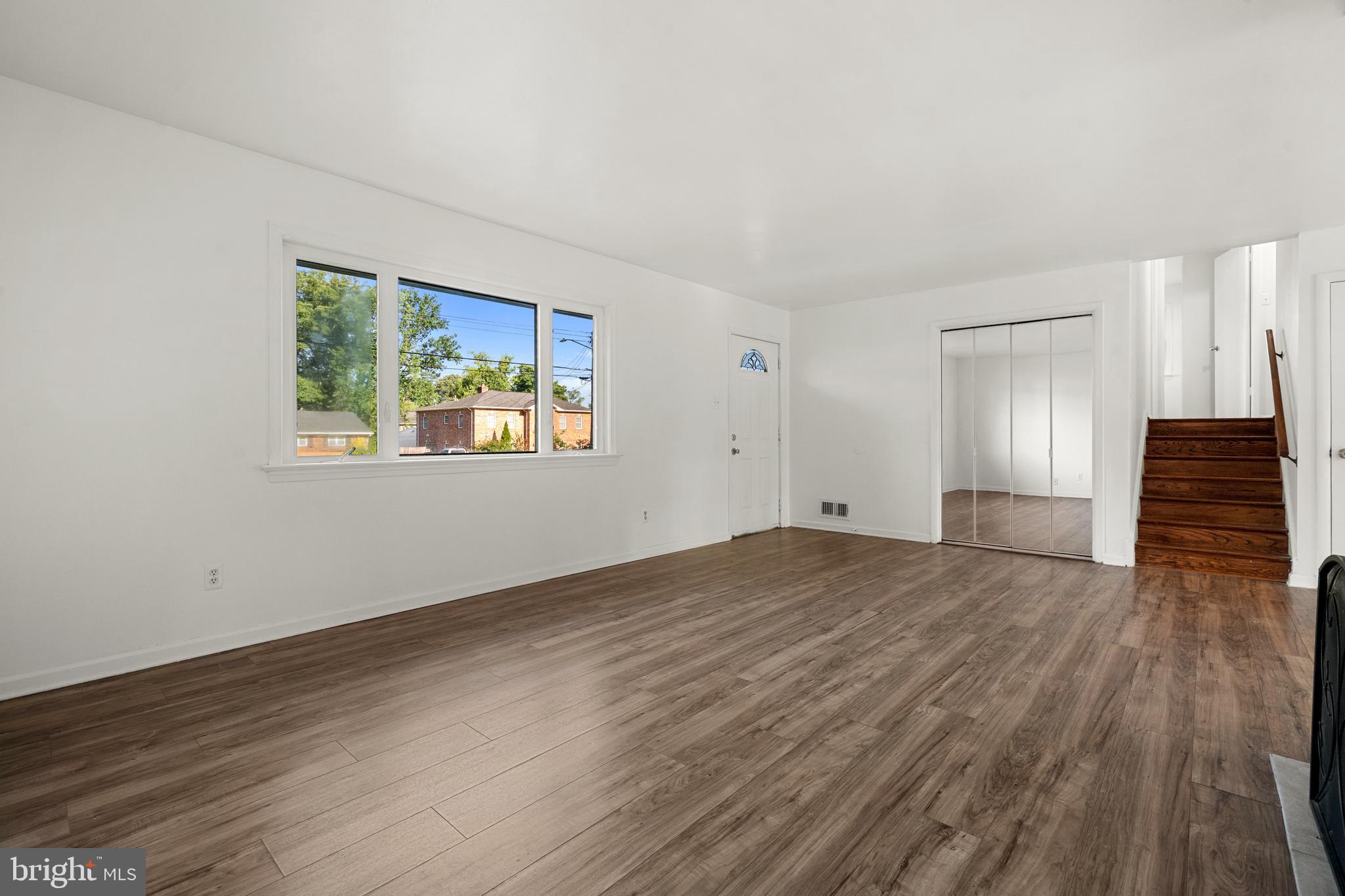5505 Heming Avenue Springfield, VA 22151 - Photo 9 of 37 a view of an empty room with wooden floor and a window