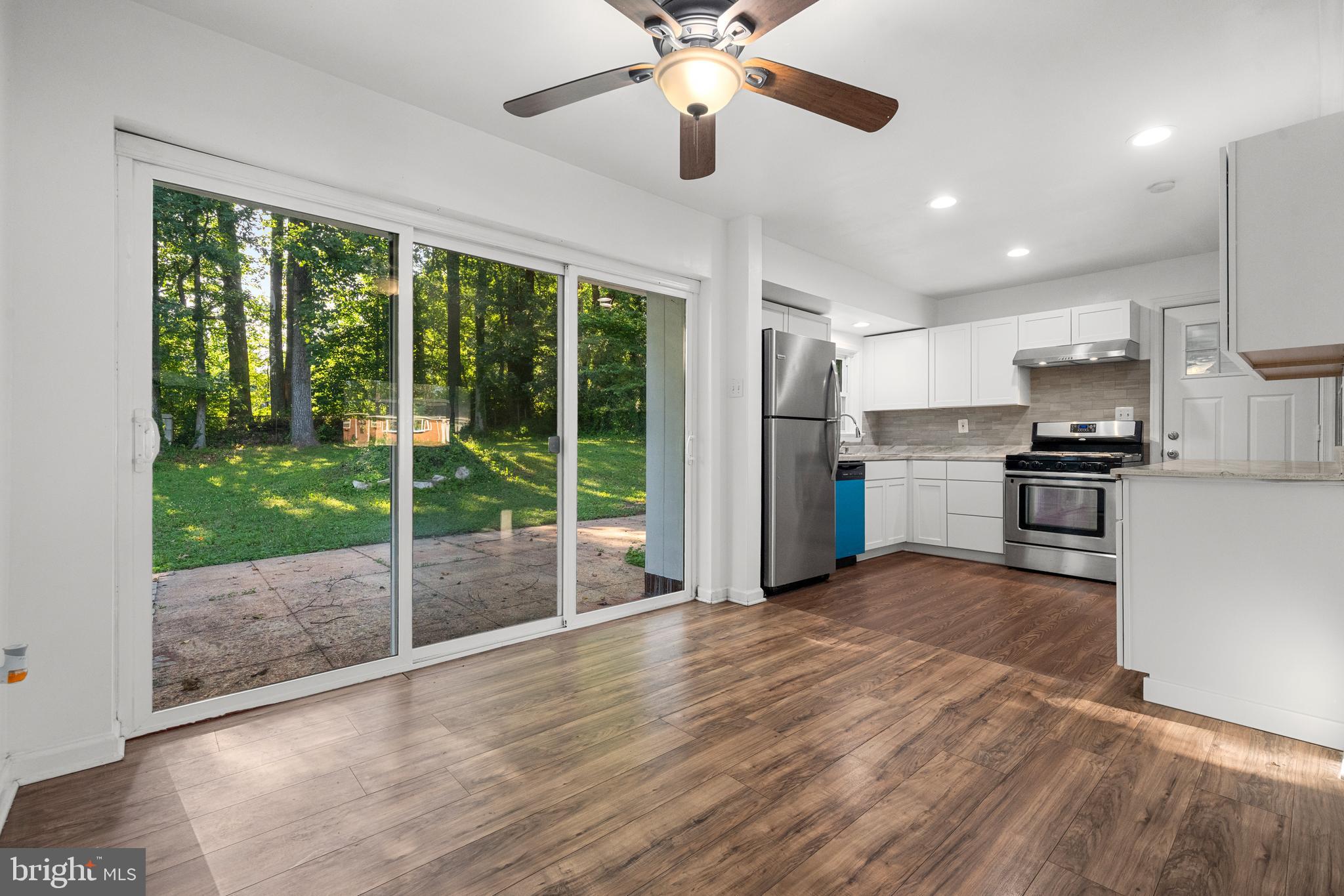 5505 Heming Avenue Springfield, VA 22151 - Photo 10 of 37 a view of kitchen with refrigerator stove and wooden floor