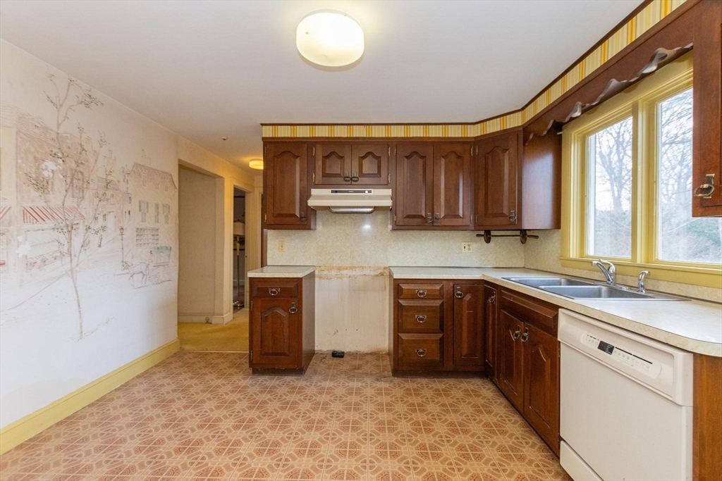 168 Richdale Road Needham, MA 02494 - Photo 7 of 18 a kitchen with stainless steel appliances granite countertop a sink a stove and a refrigerator