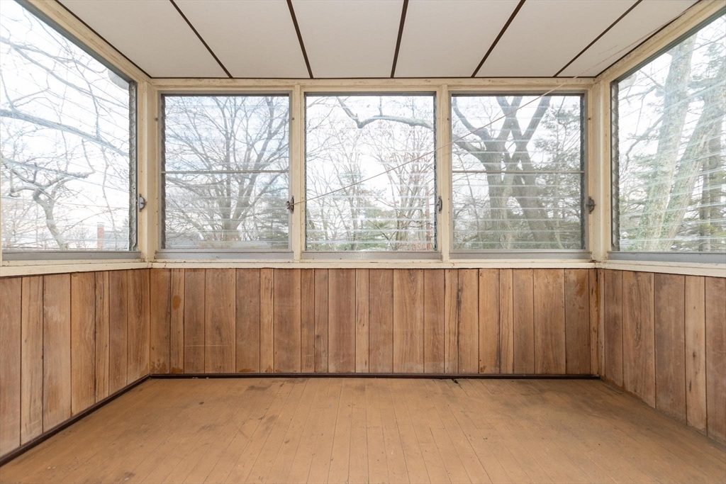 168 Richdale Road Needham, MA 02494 - Photo 10 of 18 a view of an empty room with a window and hardwood