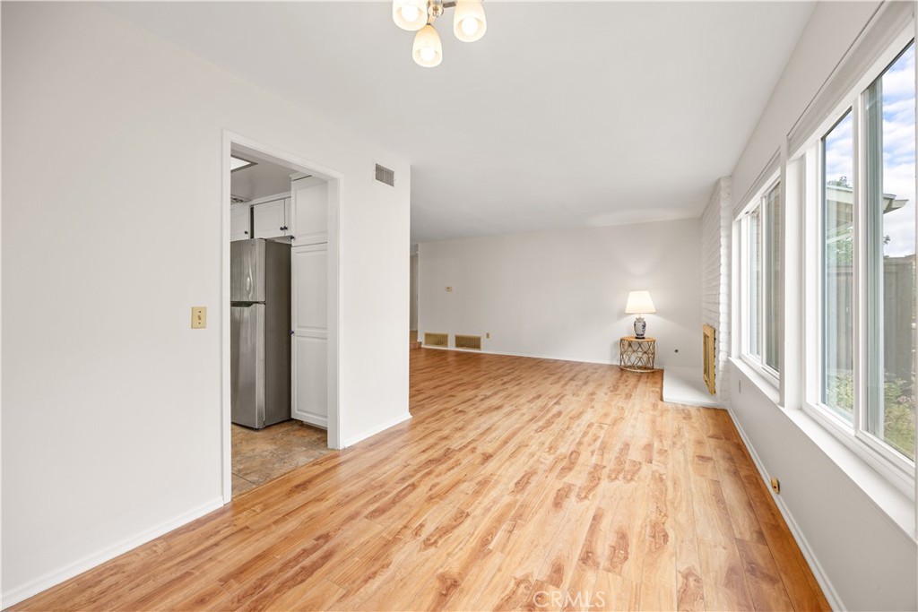 3430 Bahia Place Riverside, CA 92507 - Photo 10 of 34 a view of empty room with wooden floor and fan