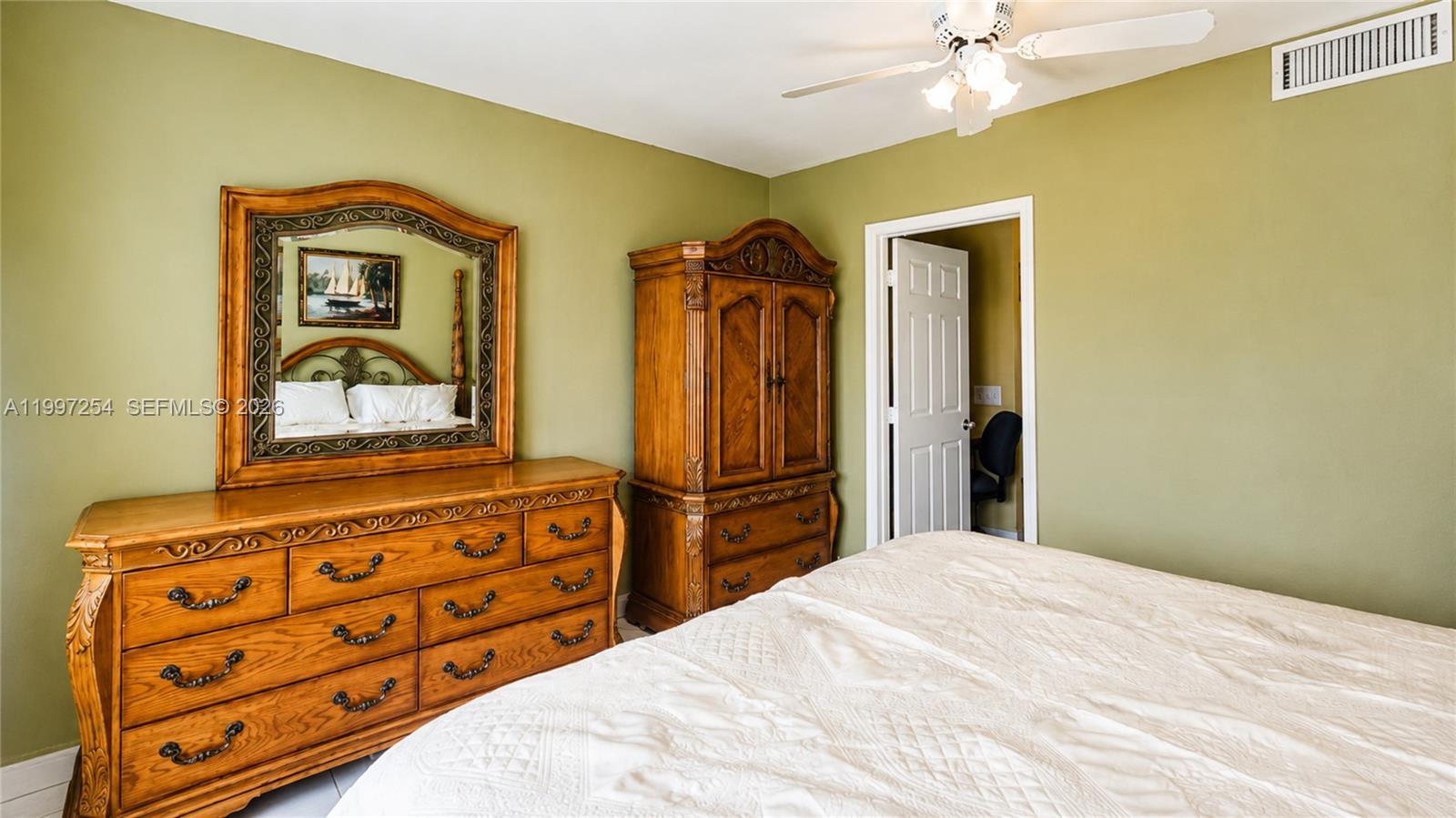 100 Lincoln Road, Unit 422 Miami Beach, FL 33139 - Photo 9 of 23 a bedroom with a bed and a mirror