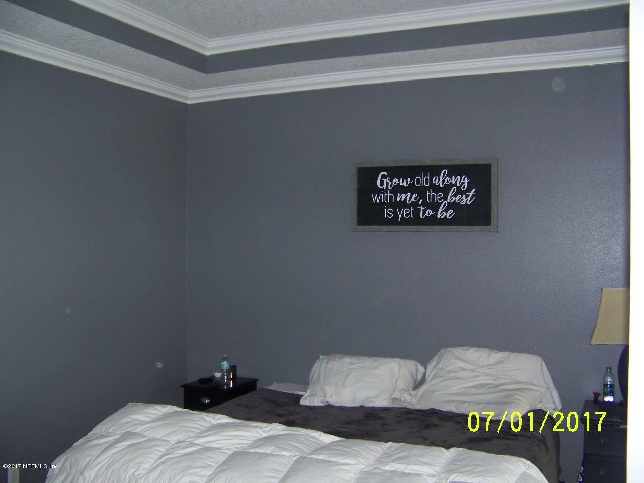 146 Raintree Circle Palm Coast, FL 32164 - Photo 7 of 18 Master bedroom