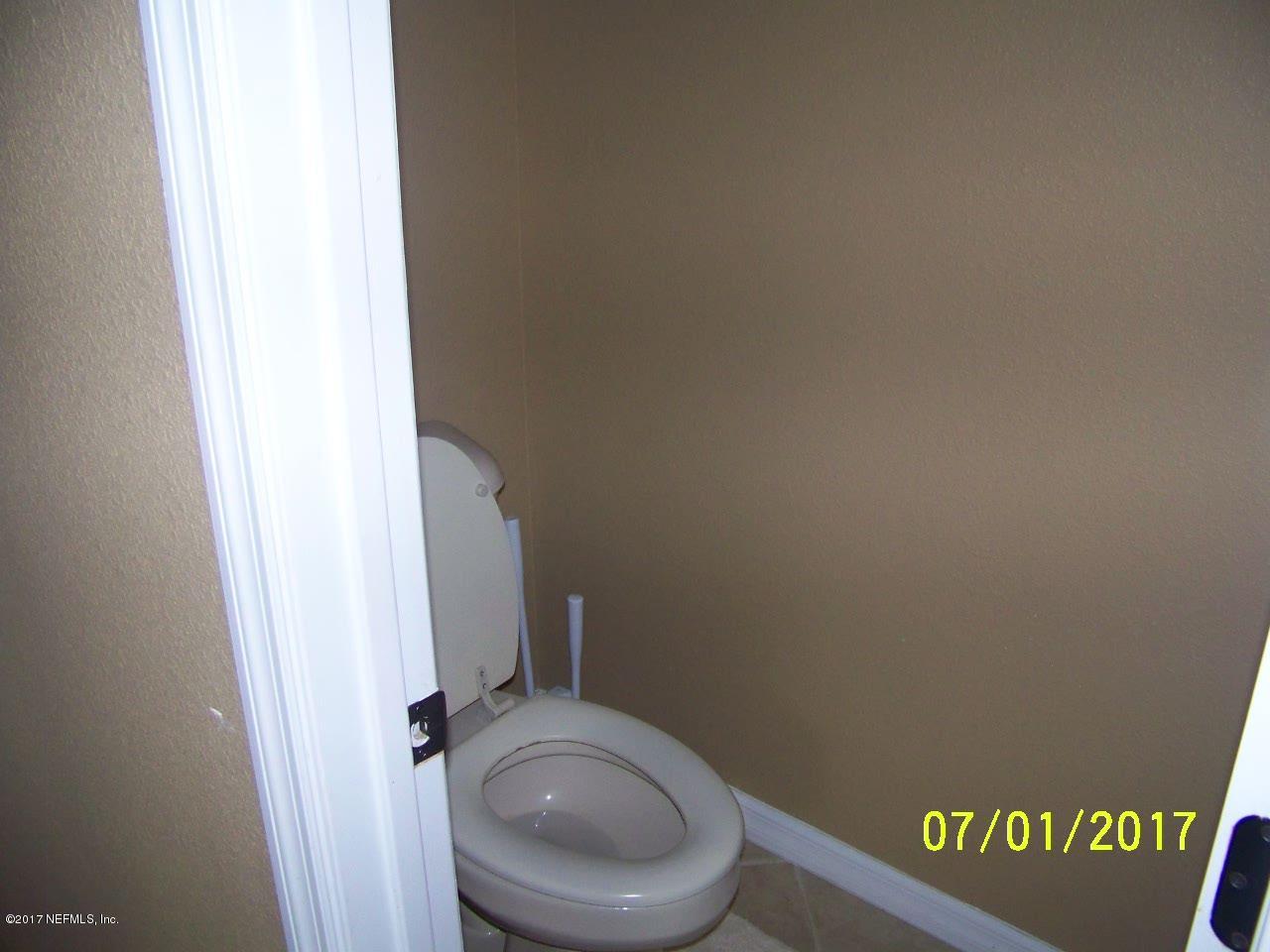 146 Raintree Circle Palm Coast, FL 32164 - Photo 10 of 18 Master bath toilet closet