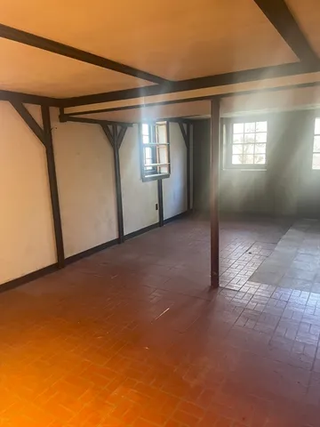 a view of empty room with windows