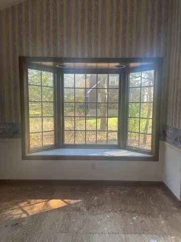 a view of an empty room with a window
