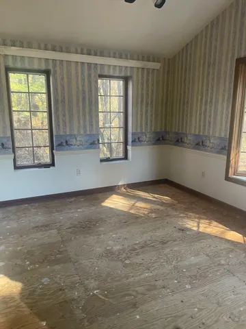 an empty room with windows