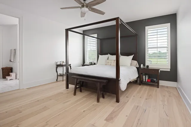 a bedroom with a bed and a dresser