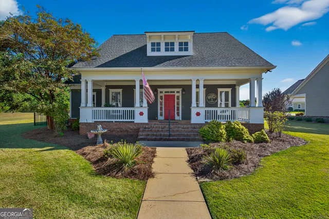 a front view of a house with garden