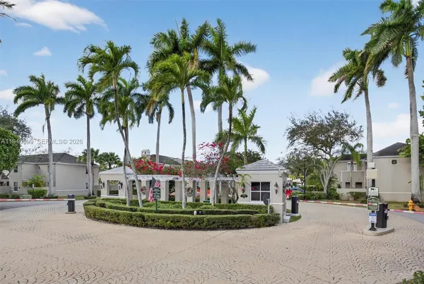 a view of a park with palm trees