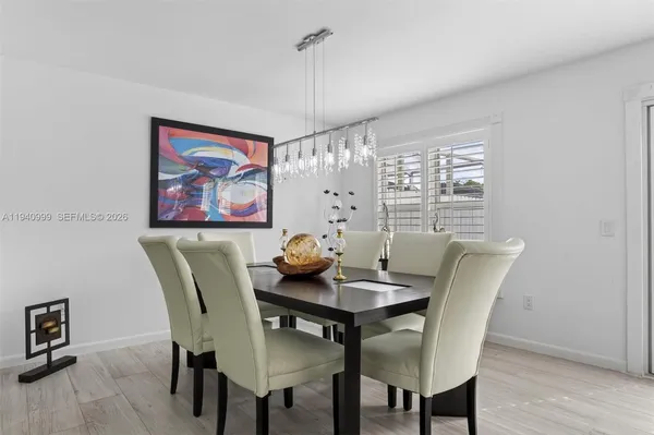 a kitchen with stainless steel appliances granite countertop a sink a stove a microwave and cabinets