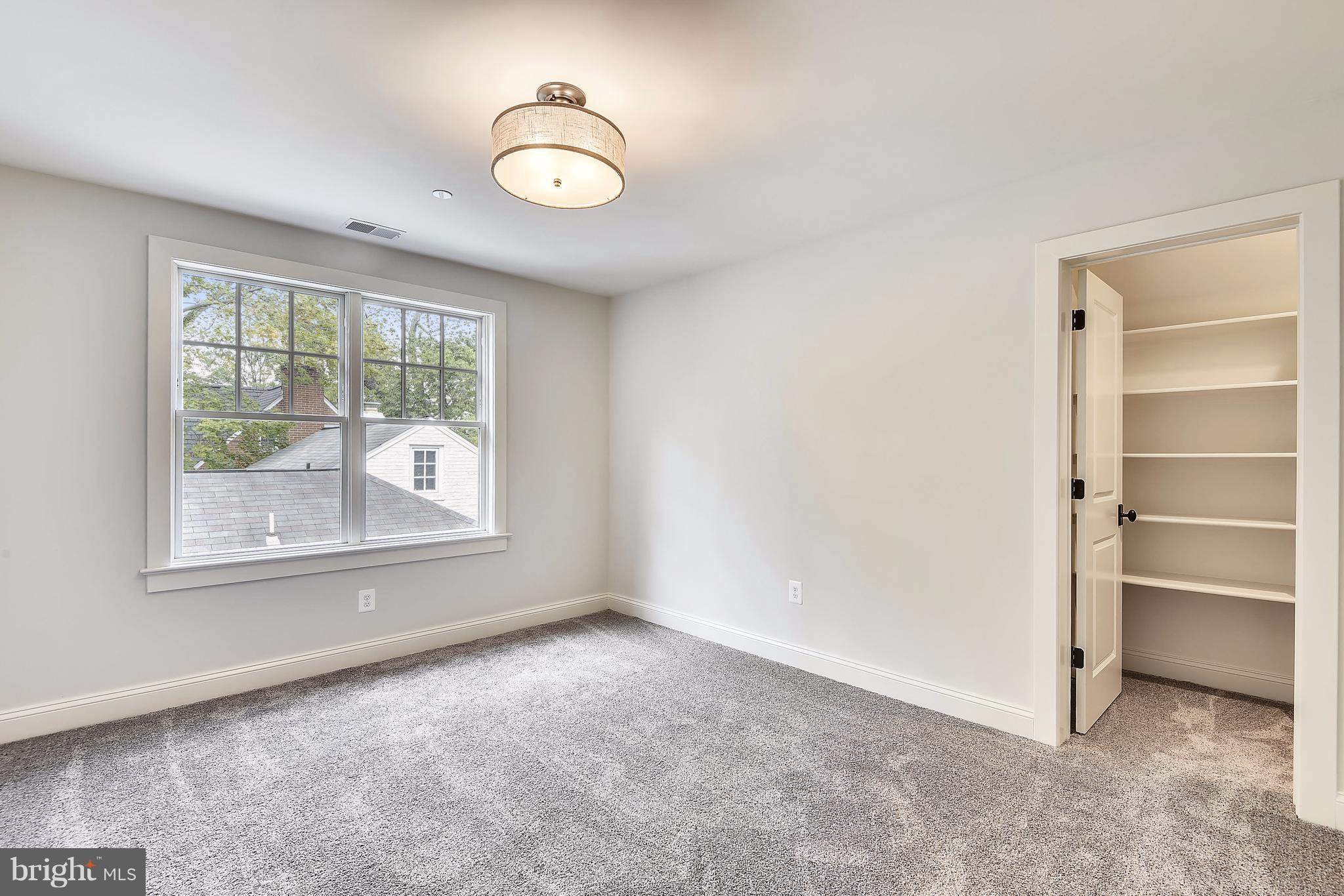 7810 Custer Road Bethesda, MD 20814 - Photo 21 of 30 an empty room with a window