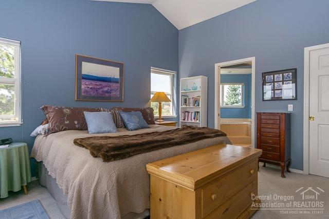 22522 Rickard Road Bend, OR 97702 - Photo 16 of 23 a bedroom with bed and window