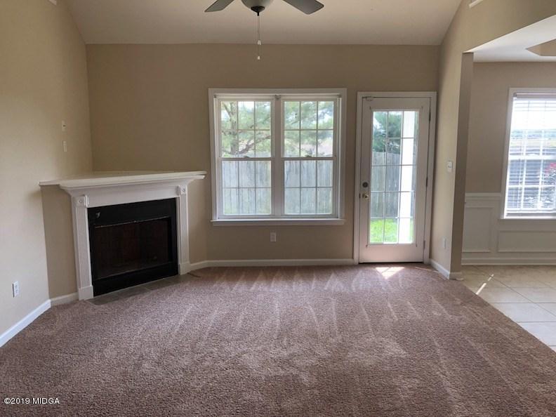 443 Bob White Road Macon, GA 31216 - Photo 2 of 7 an empty room with windows