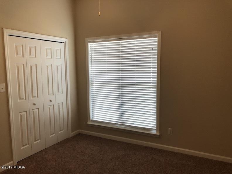 443 Bob White Road Macon, GA 31216 - Photo 5 of 7 an empty room with a window