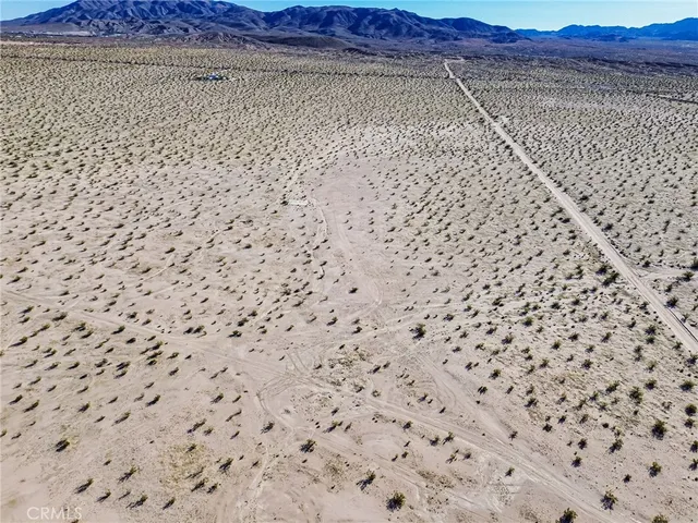 a view of a street with a building in the background
