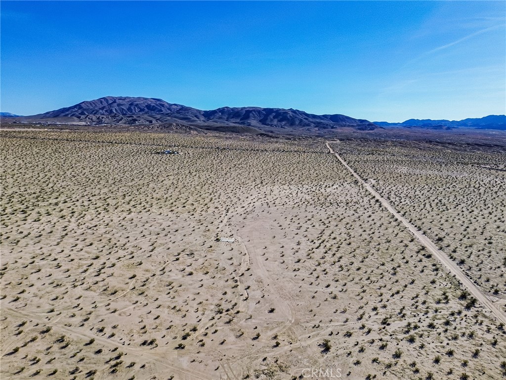 76100 2 Mile Road Twentynine Palms, CA 92277 - Photo 7 of 37 a view of a yard with an outdoor space