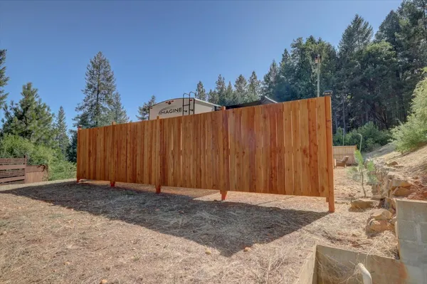 a view of entrance gate and trees
