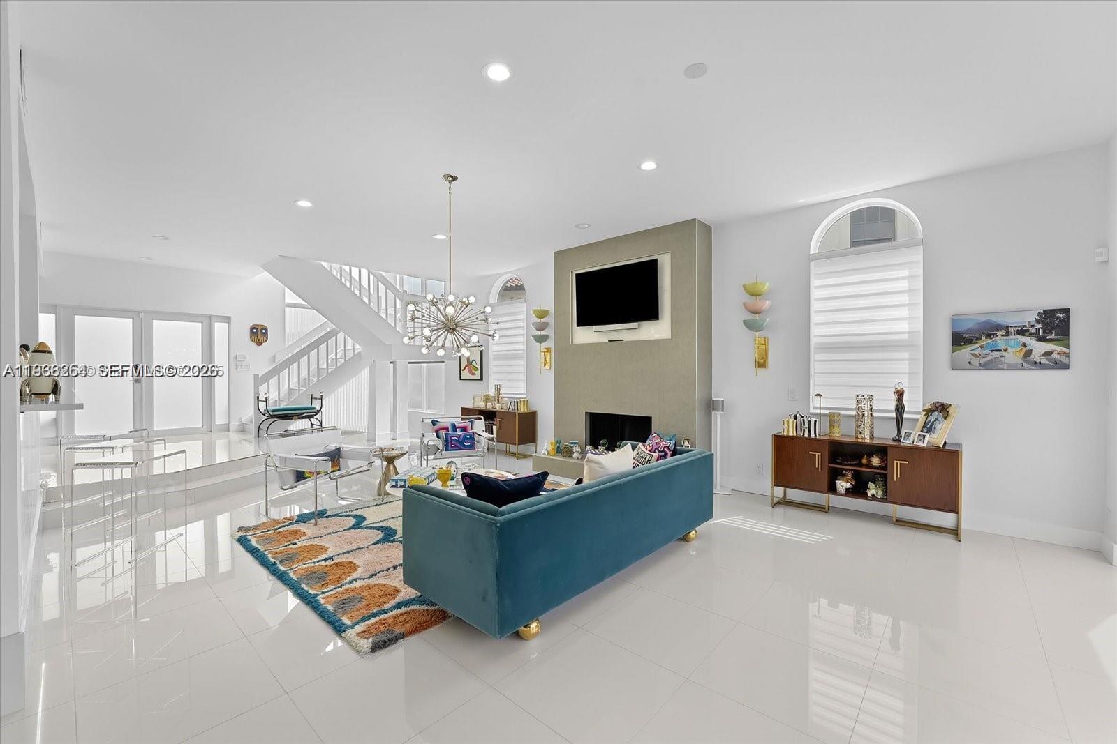 22818 El Dorado Drive Boca Raton, FL 33433 - Photo 11 of 37 a living room with furniture fireplace and a large window