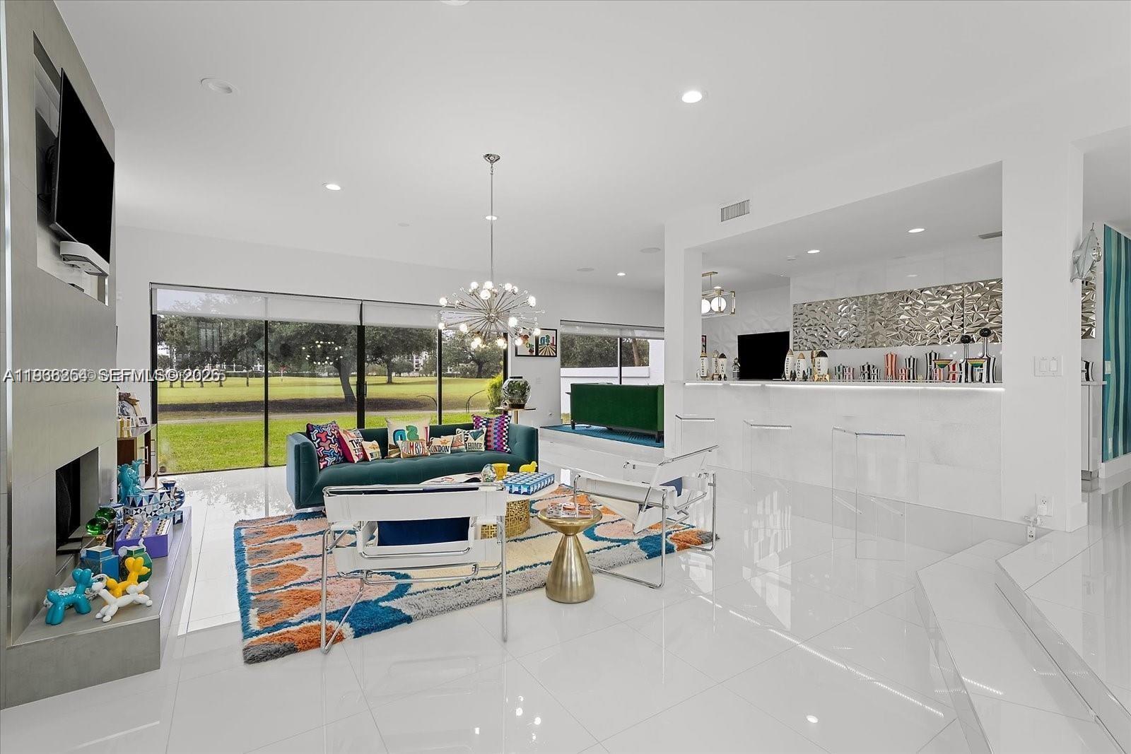 22818 El Dorado Drive Boca Raton, FL 33433 - Photo 13 of 37 a room with furniture and a flat screen tv