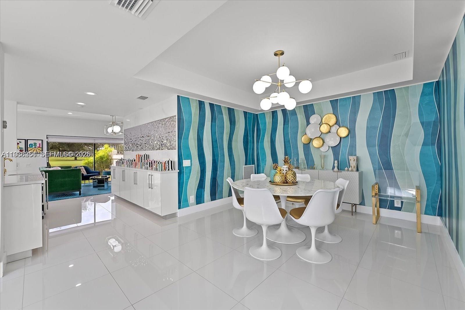 22818 El Dorado Drive Boca Raton, FL 33433 - Photo 19 of 37 a view of a dining room with furniture and chandelier