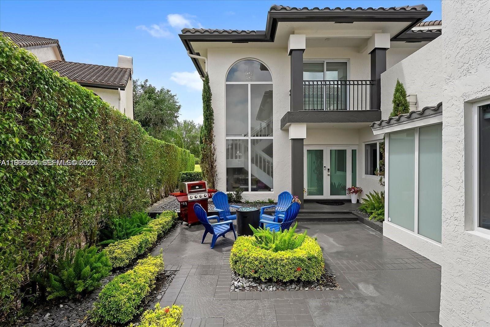 22818 El Dorado Drive Boca Raton, FL 33433 - Photo 2 of 37 a front view of a house with yard and porch