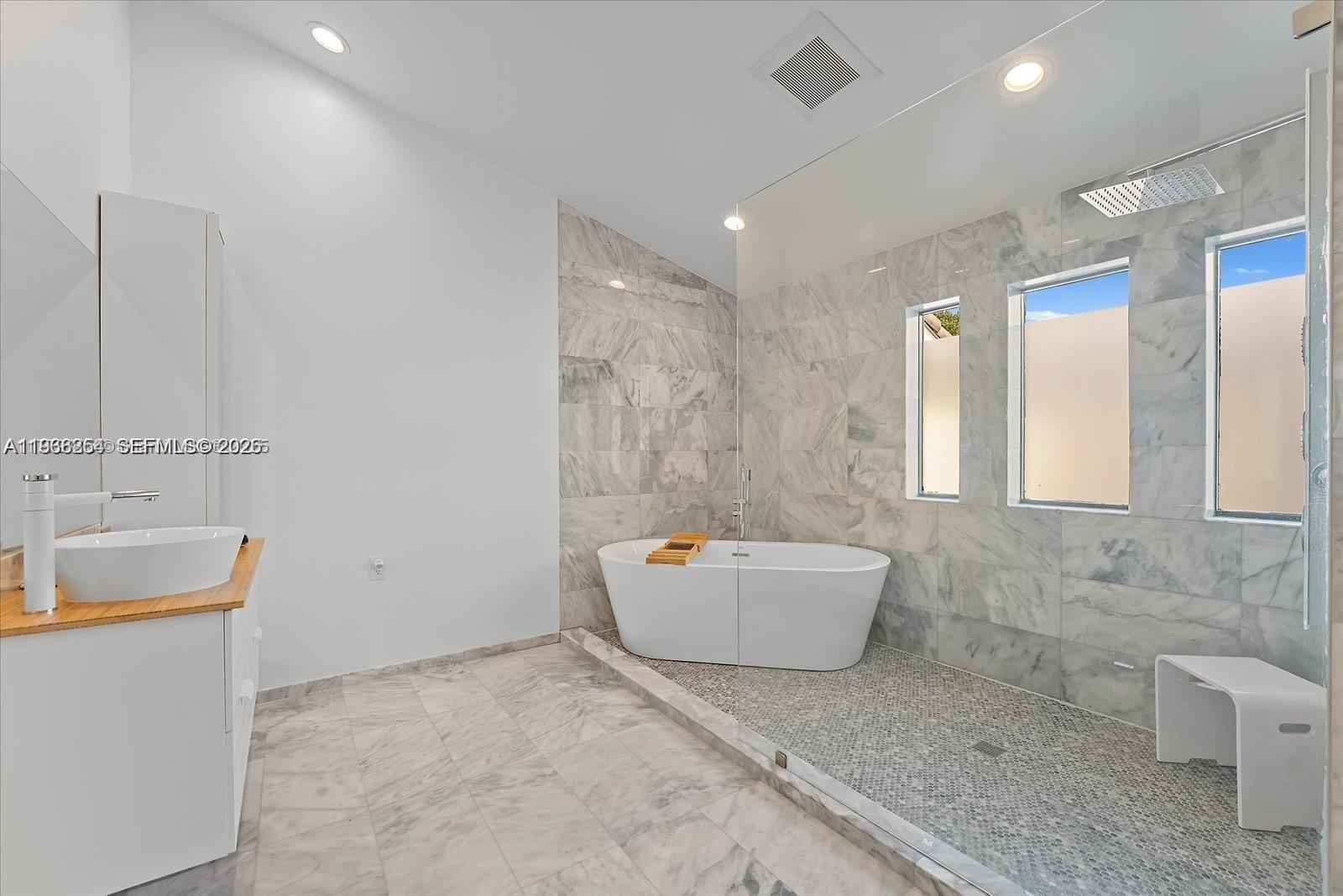 22818 El Dorado Drive Boca Raton, FL 33433 - Photo 23 of 37 a bathroom with a sink a toilet and mirror