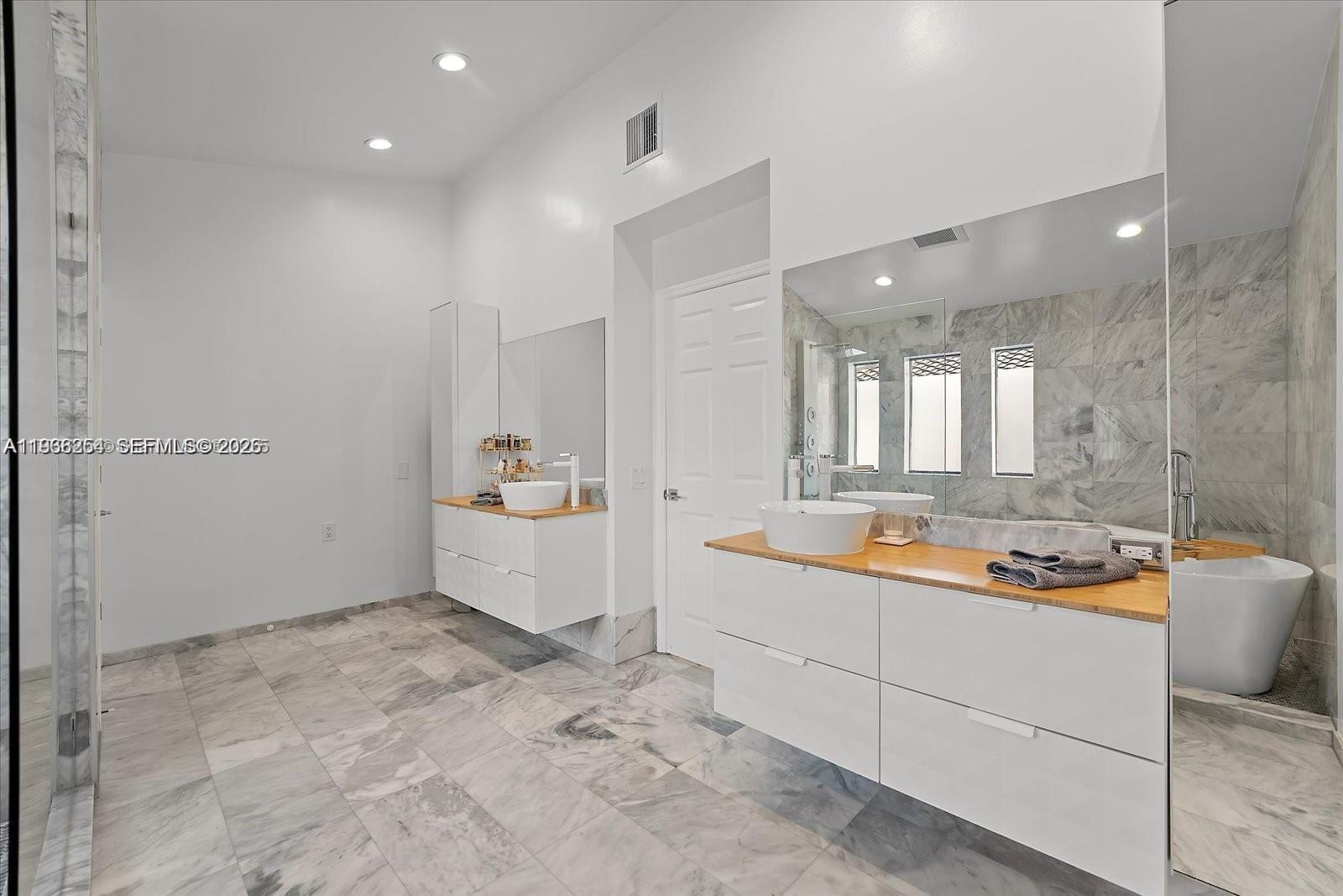 22818 El Dorado Drive Boca Raton, FL 33433 - Photo 24 of 37 a bathroom with a sink a toilet and shower