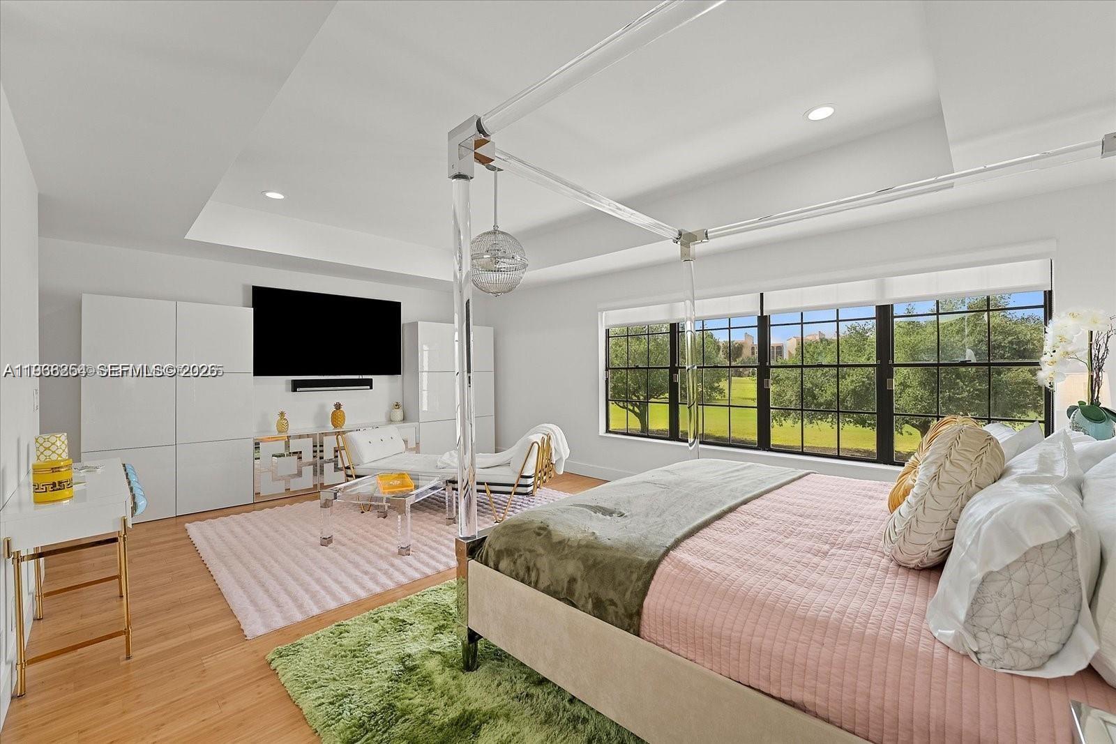 22818 El Dorado Drive Boca Raton, FL 33433 - Photo 29 of 37 a bed room with a bed television and a large window