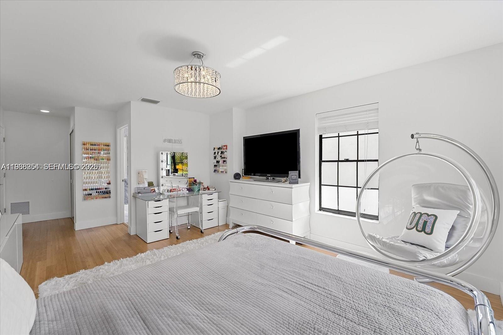 22818 El Dorado Drive Boca Raton, FL 33433 - Photo 30 of 37 a bedroom with a large bed and a flat tv screen