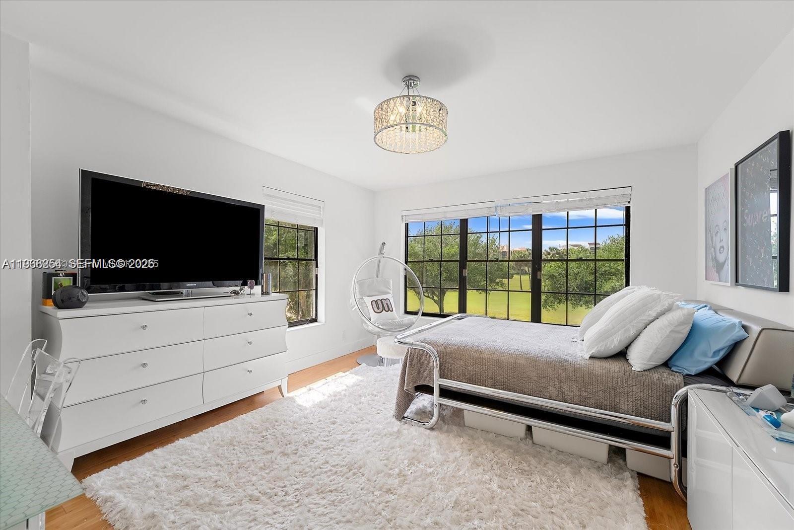 22818 El Dorado Drive Boca Raton, FL 33433 - Photo 31 of 37 a bedroom with furniture and flat screen tv