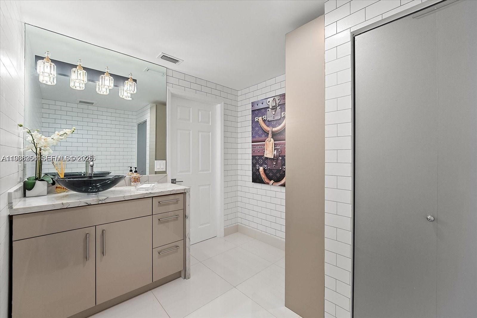 22818 El Dorado Drive Boca Raton, FL 33433 - Photo 35 of 37 a bathroom with a sink and mirror