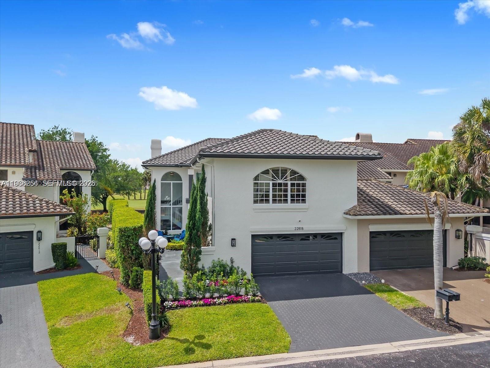 22818 El Dorado Drive Boca Raton, FL 33433 - Photo 5 of 37 a view of a house with a swimming pool