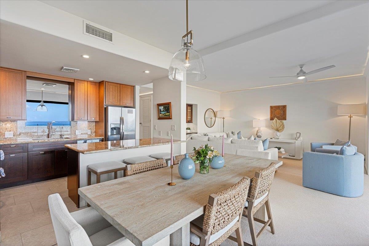 4850 Makena Alanui Road, Unit E205 Kihei, HI 96753 - Photo 15 of 45 a view of a dining room with furniture