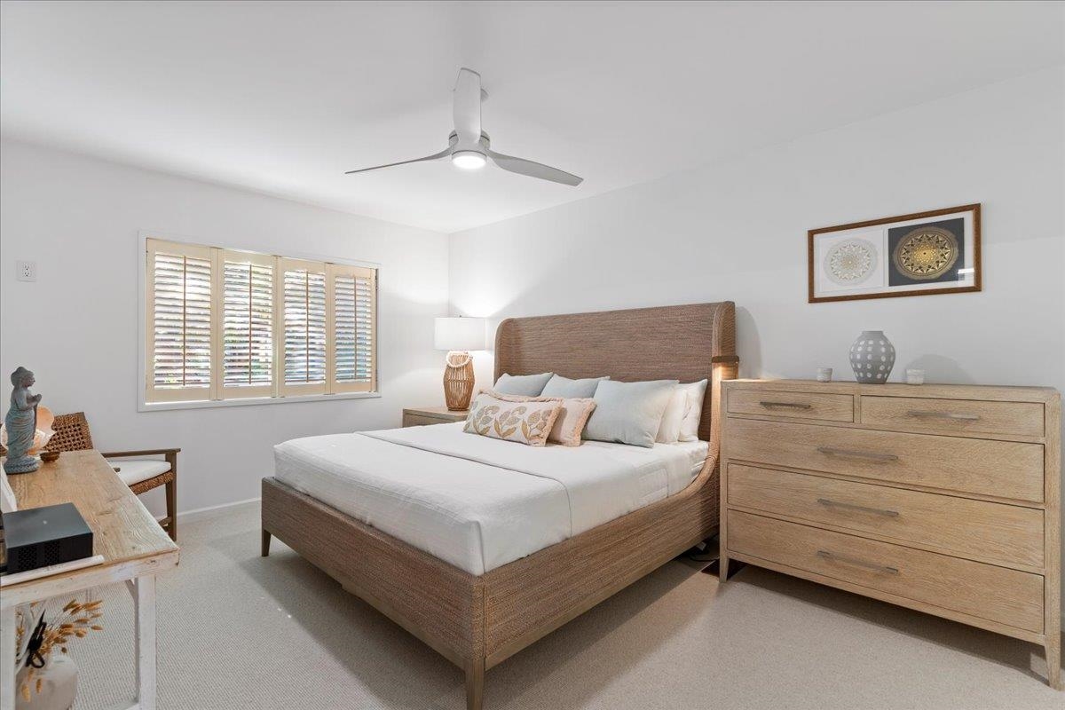 4850 Makena Alanui Road, Unit E205 Kihei, HI 96753 - Photo 19 of 45 a bedroom with a bed and window