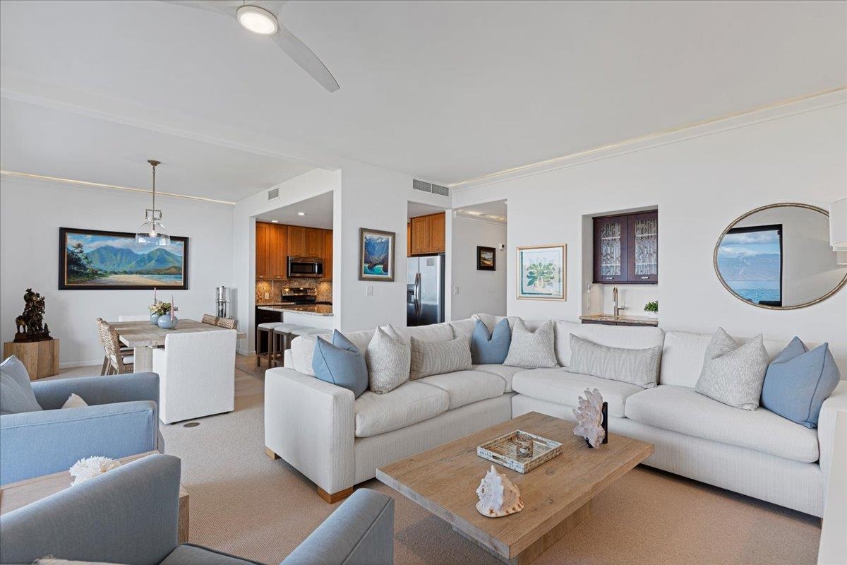 4850 Makena Alanui Road, Unit E205 Kihei, HI 96753 - Photo 2 of 45 a living room with furniture or couch and a flat screen tv
