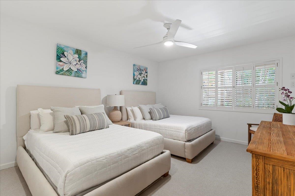 4850 Makena Alanui Road, Unit E205 Kihei, HI 96753 - Photo 25 of 45 a bedroom with bed and window