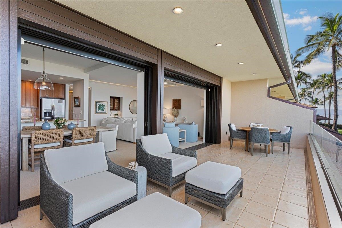 4850 Makena Alanui Road, Unit E205 Kihei, HI 96753 - Photo 30 of 45 a living room with furniture and a potted plant