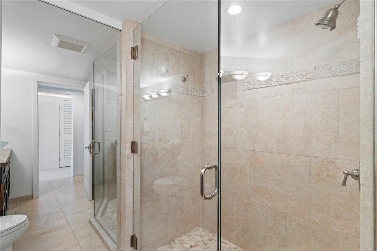 4850 Makena Alanui Road, Unit E205 Kihei, HI 96753 - Photo 43 of 45 a bathroom with a shower and a toilet