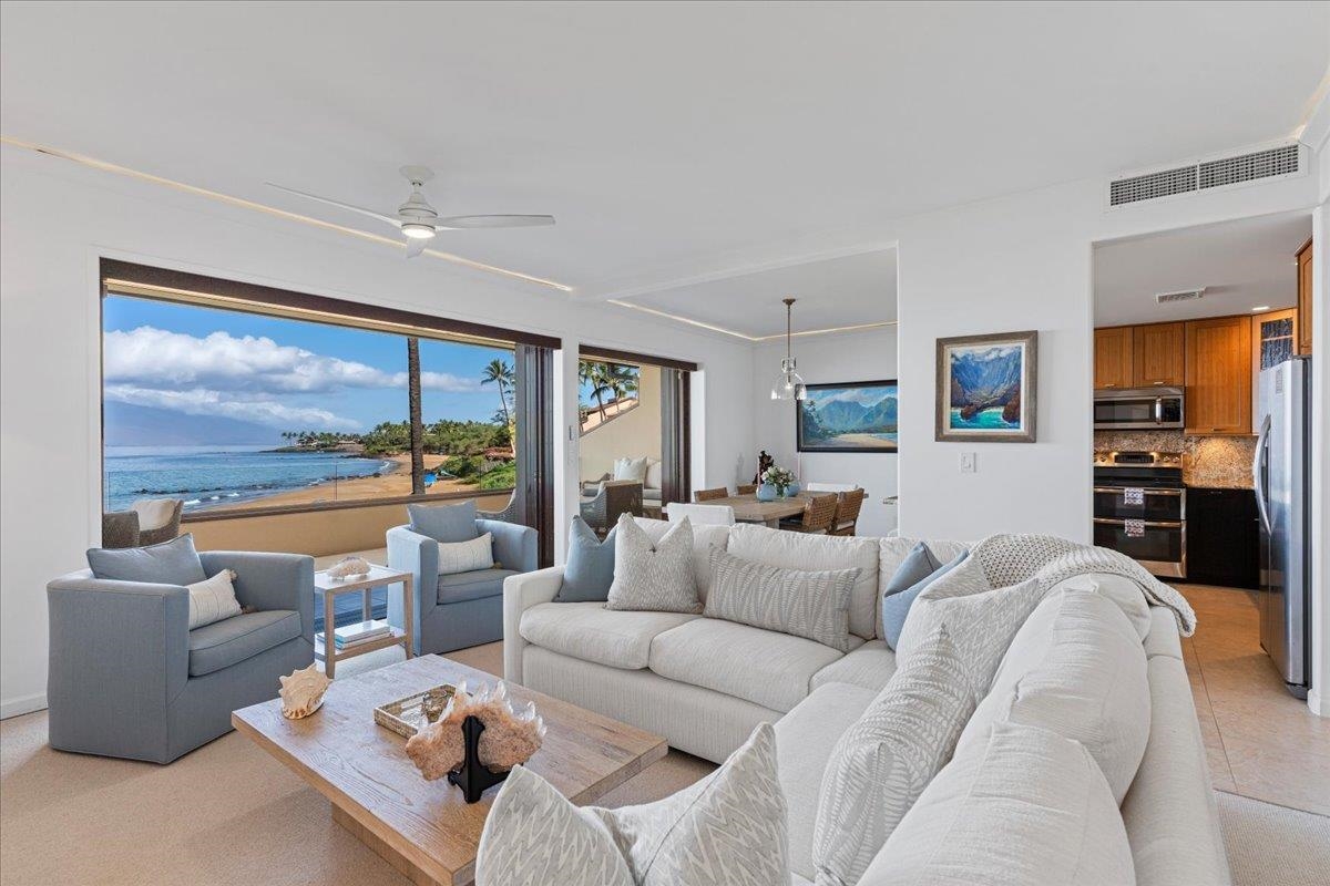 4850 Makena Alanui Road, Unit E205 Kihei, HI 96753 - Photo 8 of 45 a living room with furniture and a large window