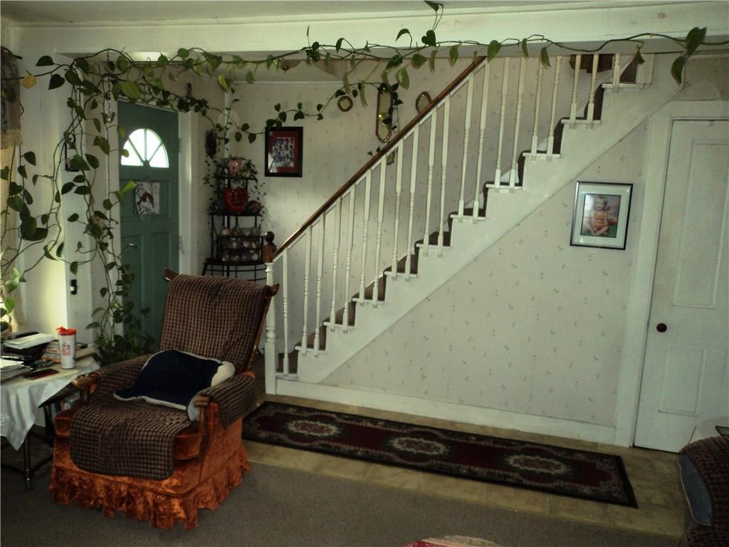 80 Reardon Road Milo, ME 04463 - Photo 19 of 19 Living room with front door and open...