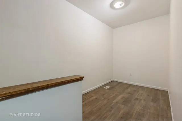 a view of small space with wooden floor