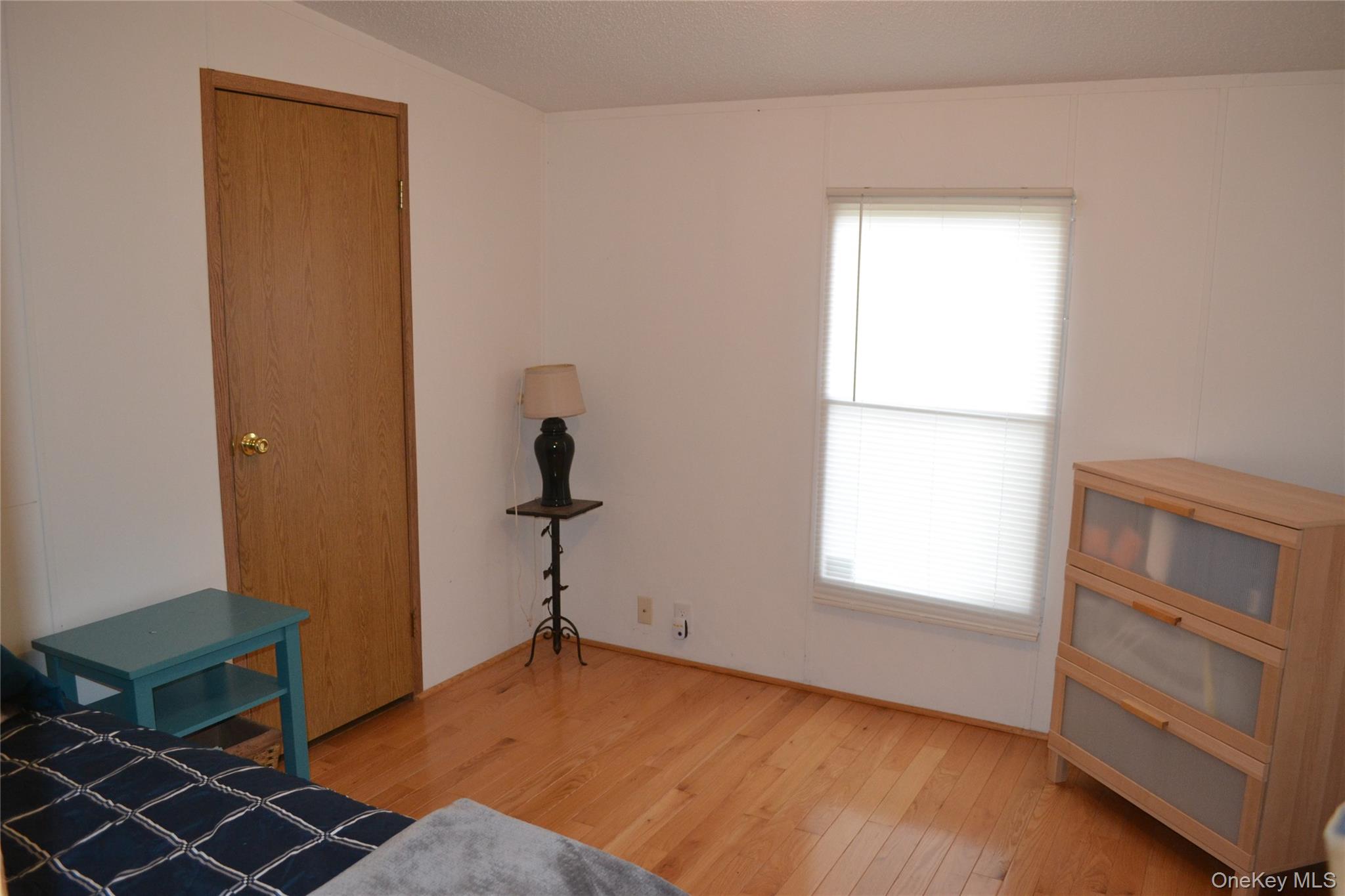 144 Bonnie Brook Road Roscoe, NY 12776 - Photo 19 of 34 Bedroom featuring light wood finished floors and a textured ceiling