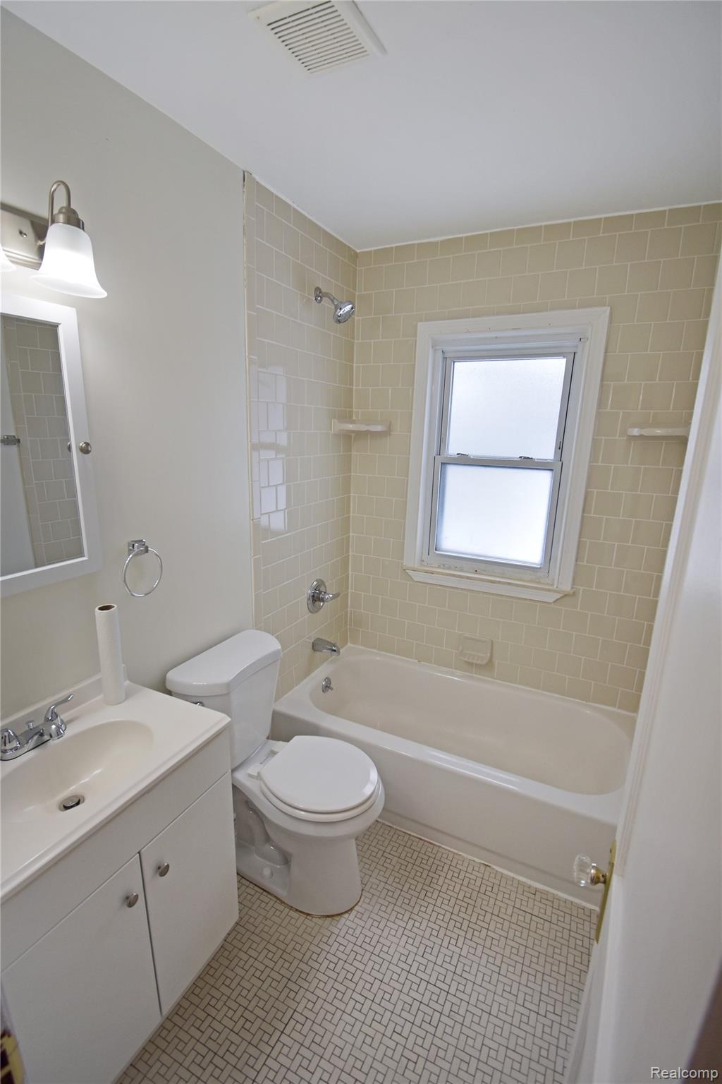 8305 Stephens Road Center Line, MI 48015 - Photo 9 of 23 Bathroom with tub / shower combination and vanity