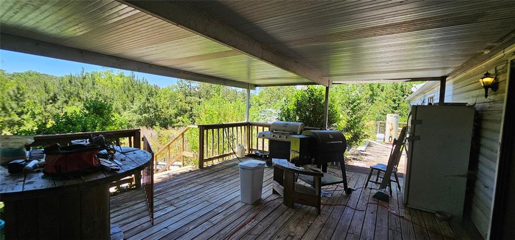 944 Lite-N-Tie Road Macon, GA 31211 - Photo 36 of 36 a view of a porch with furniture and wooden floor