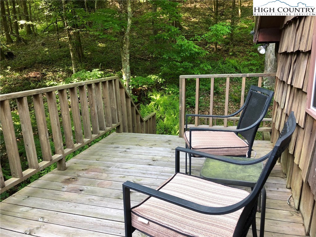 257 Cameron Terrace Boone, NC 28607 - Photo 22 of 42 a wooden bench sitting in wooden roof deck