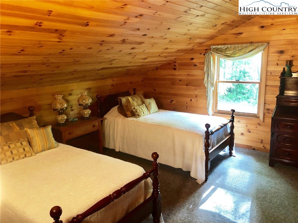 257 Cameron Terrace Boone, NC 28607 - Photo 28 of 42 a bedroom with a bed and a window