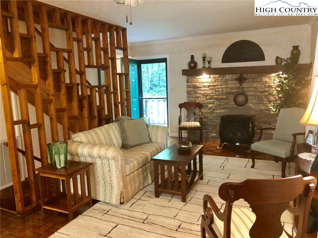257 Cameron Terrace Boone, NC 28607 - Photo 5 of 42 a living room with furniture and a fireplace