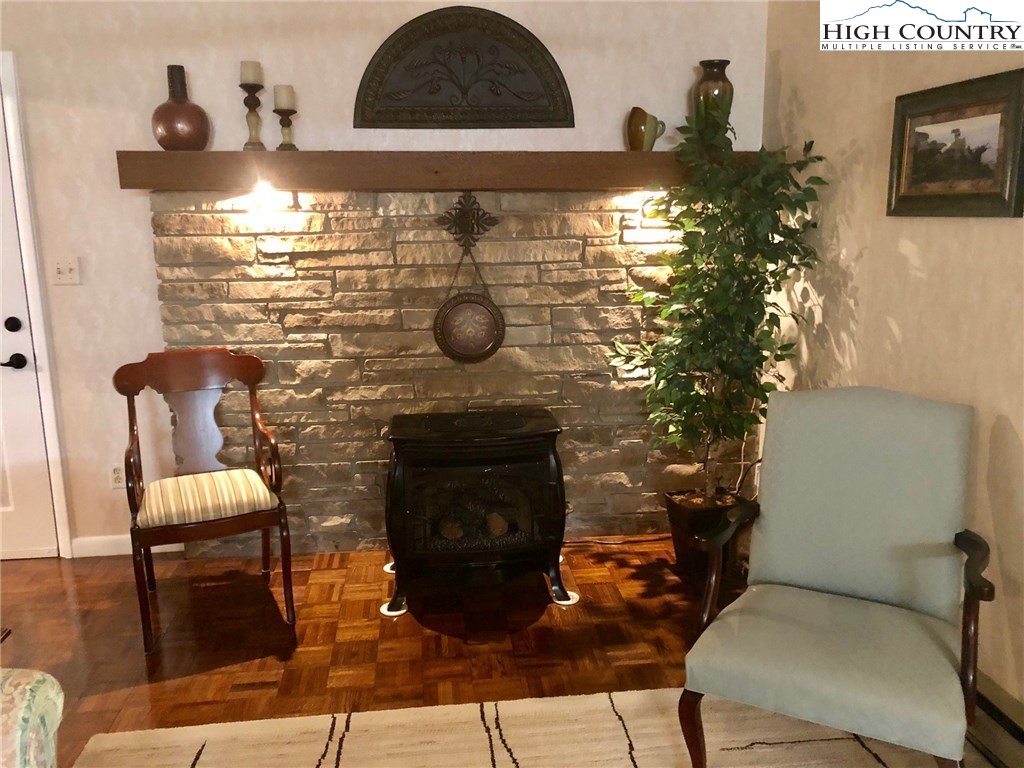 257 Cameron Terrace Boone, NC 28607 - Photo 7 of 42 a room with furniture and a fireplace