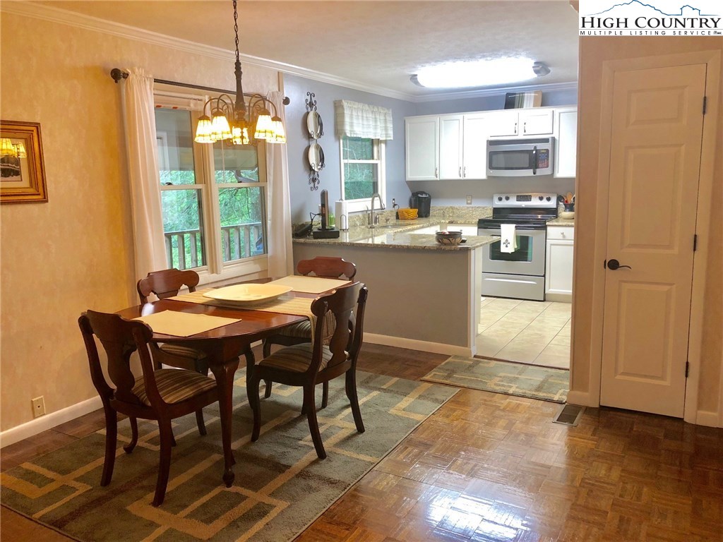 257 Cameron Terrace Boone, NC 28607 - Photo 10 of 42 a kitchen with a table and chairs in it